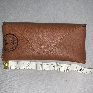 Lightly used brown Rayband eyeglass case with with soft material interior.